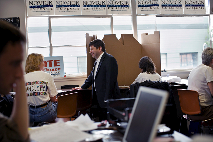 Steve Novick (Democrat for U.S. Senate), center standing, talks with a volunteer Diane Hopper, second from left, at his campaign headquarter in SE Portland.